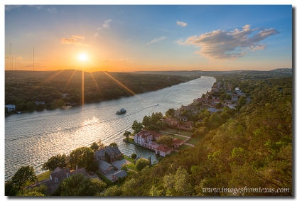 The sun falls into the Texas Hill Country. This Austin image comes from Mount Bonnell on a peaceful May evening.